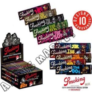 CARTINE SMOKING COLLECTION KUKUXUMUSU CENTENARY KING SIZE SLIM 33 SOTTILI FOGLIE + 33 FILTRI DI CARTA CON 6 PERFORAZIONI COLLEZIONE IN 10 DISEGNI SCATOLA COMPLETA 24 PEZZI
